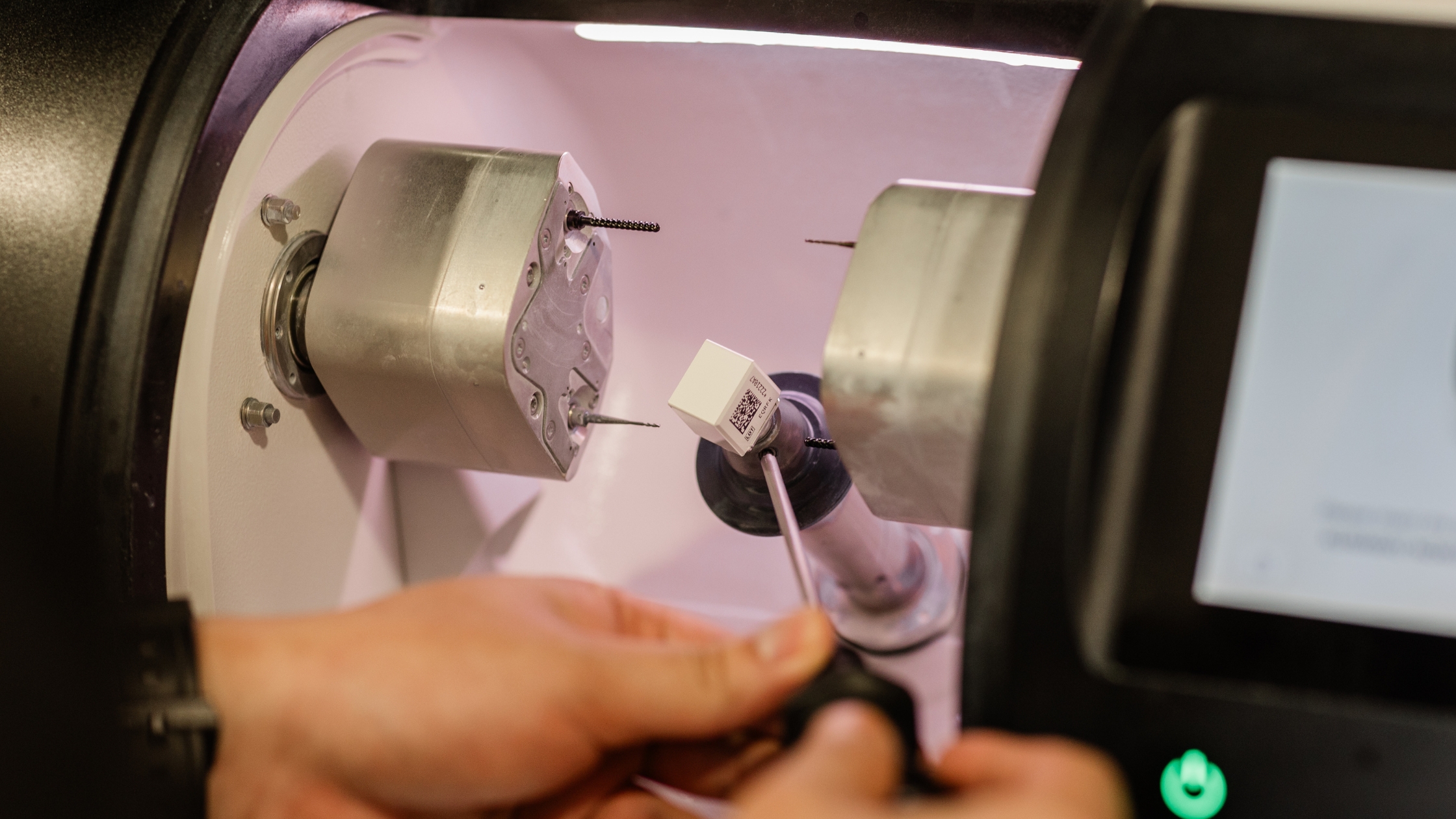 In-clinic milling unit shaping a ceramic crown after a root canal Ormeau patients may need