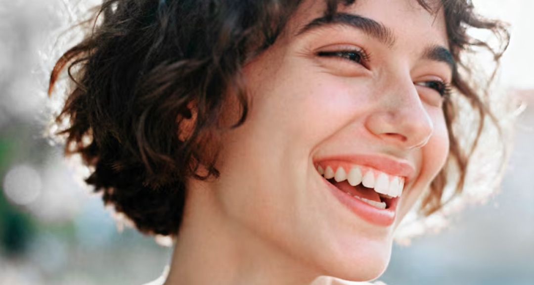 Woman with a healthy smile after a dental check-up Ormeau